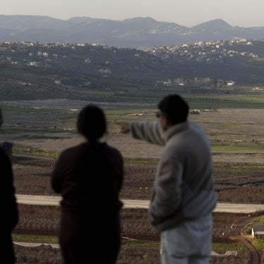 Israelis look at the border with Lebanon from a position in the northern village of Metula on March 5, 2026, after Hezbollah launched rockets at Israel during the ongoing conflict.