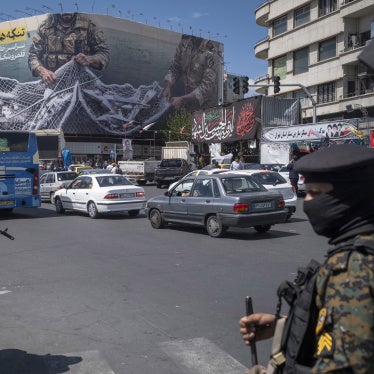 Two members of Iran’s security forces stand guard in downtown Tehran, Iran, on April 8, 2026.