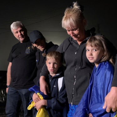 A mother hugs her children after their return from the occupied territory of Ukraine via the Ukraine-Belarus border, amid Russia's attack on Ukraine, in Volyn region, Ukraine, on September 3, 2023.