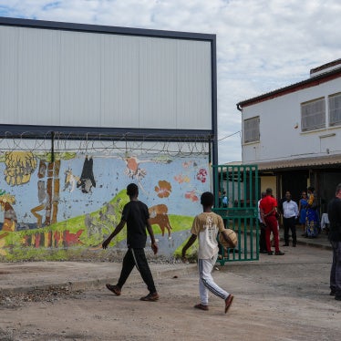Children walk past modular classrooms built after Cyclone Chido, at the nursery and elementary school of Majicavo-Lamir village on the French overseas territory of Mayotte, on August 18, 2025.