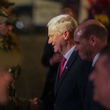 Chilean President José Antonio Kast greets police officers after announcing a new security agenda and stricter immigration enforcement, at the Plaza de Armas in Santiago, Chile, August 6, 2026. 