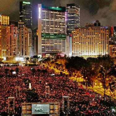 People attending a candlelight vigil