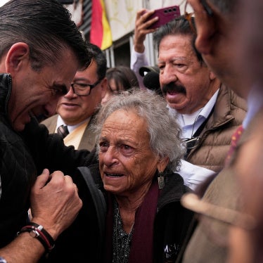 Bolivian President Rodrigo Paz (left), meets with activist Amparo Carvajal before entering the offices of the Permanent Assembly of Human Rights of Bolivia (APDHB), in La Paz, Bolivia, November 20, 2025.