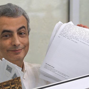 Lev Shlosberg, deputy leader of the Yabloko party, stands in the defendant's box