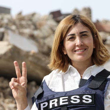 Amal Khalil, a veteran correspondent for the daily newspaper Al-Akhbar, in the southern Lebanese border village of Jebbayn in 2024