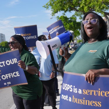 People demonstrate against proposed changes to the US Postal Service and President Donald Trump's executive order regarding mail-in ballots, Miami, Florida, July 28, 2026. 