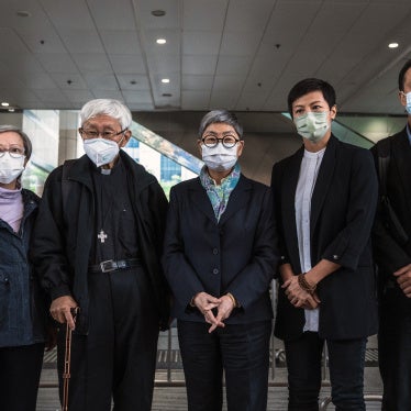Former trustees of the 612 Humanitarian Relief Fund, following a verdict at the West Kowloon Magistrates' Courts in Hong Kong, November 25, 2022.