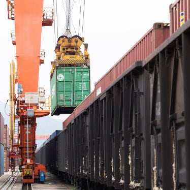 Containers are loaded onto a China-Europe Railway Express (Yiwu-Xinjiang-Europe) market procurement train at the Jinhua Yiwu Railway West Station in Jinhua, China, on June 8, 2026.