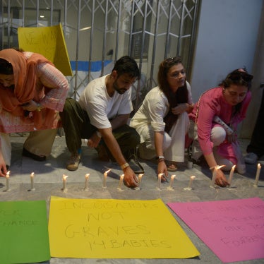 People light candles in memory of the newborn victims outside the Pakistan Institute of Medical Sciences, in Islamabad, Pakistan, August 27, 2026. 