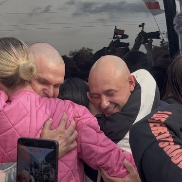 TOR BAND musicians, former political prisoners, embrace their loved ones after arriving in Vilnius on September 16, 2026.