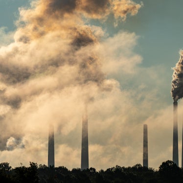 Pollution and steam are seen rising from the stacks of the Miami Fort Power Station along the Ohio River, in North Bend, Ohio, on July 23, 2026. 