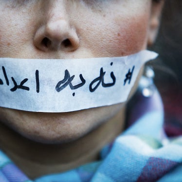 A person's mouth covered with tape bearing a message “no to executions” in Iran, in Paris in France, January 31, 2026.