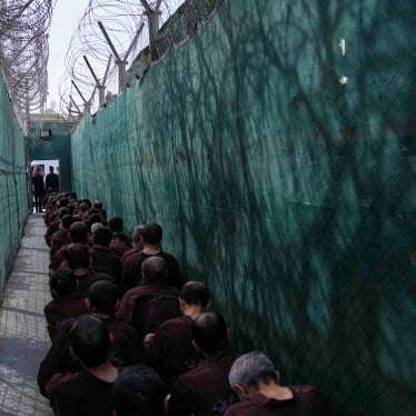 Men accused of Islamic State links await questioning at Al-Karkh prison in Iraq following their transfer from northeast Syria, February 12, 2026.