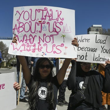 Participants hold placards during the Act NOW Rally hosted by Barrier-Free Alberta in front of the Alberta Legislature, Canada, May 6, 2025.