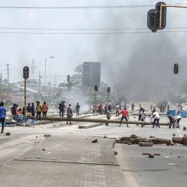 Protesters use different materials to build barricades and block a road as clashes erupt in Dar es Salaam during Tanzania's presidential elections on October 29, 2025.