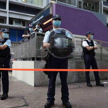 Police officers stand guard outside the Prince Edward subway station