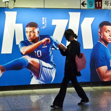 An advertisement featuring French soccer star Kylian Mbappé in Shanghai, China, June 30, 2026.