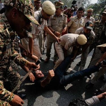 Police detain protesters during a demonstration 