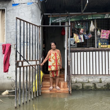 Aidaliza Aquino spends most of her time indoors because of the daily flooding at the Pulo relocation site in Barangay Candelaria, Macabebe, Pampanga, Philippines, July 13, 2026. 