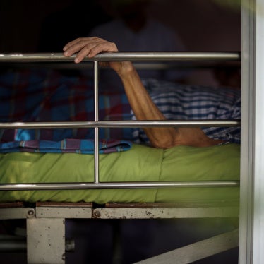 A person lies in bed at a nursing home in Ayutthaya, Thailand, April 9, 2016.