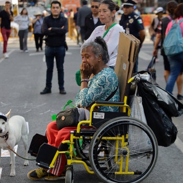 A dog and a woman with a disability outside the Supreme Court of Justice of the Nation in Mexico City, Mexico, March 24, 2026.