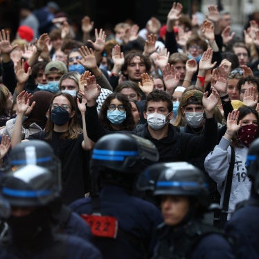 Students raise their hands in front of police officers as they demonstrate outside Sciences Po during a protest over school overcrowding and decay in Paris, France, October 7, 2026. 