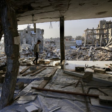 A Palestinian boy walks inside a destroyed building in Khan Yunis in the southern Gaza Strip, January 27, 2026.