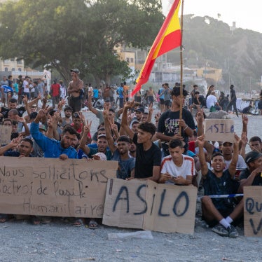  People on Trampolín beach in Ceuta, Spain, protesting to be allowed apply for asylum, August 2026.
