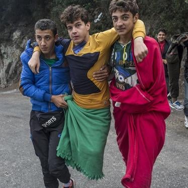 18-year-old Mohammed, who said he lost both legs to a Syrian airstrike in Idlib in 2012, is carried by friends on the island of Lesbos in Greece. Both his friends and parents accompanied him on his journey to safety, carrying him whenever needed.