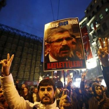 A demonstrator holds a picture of Bar Association President Tahir Elci during a protest in Istanbul, Turkey.