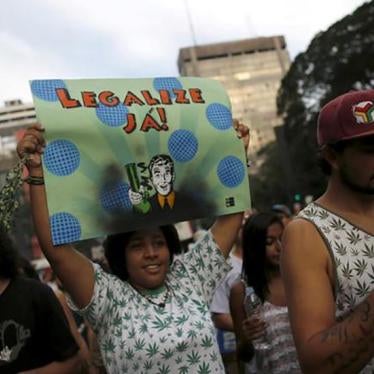 A woman holds up a sign that reads "legalize" during a demonstration in support of the legalization of marijuana in Sao Paulo, Brazil on May 23, 2015.