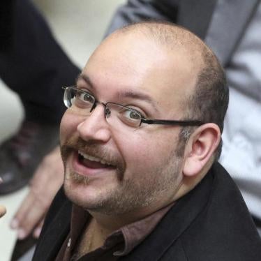Jason Rezaian, an Iranian-American correspondent for the Washington Post, smiles as he attends a presidential campaign of President Hassan Rouhani on April 11, 2013 in Tehran, Iran. 