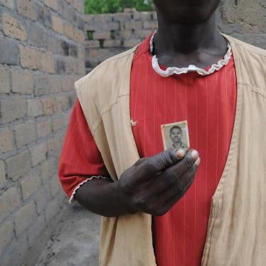 Resident of Ndanika holding a photo of his father who died in the bush after fleeing the Seleka on April 14, 2013. 