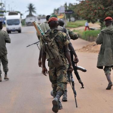 Soldiers from the Republican Forces of Côte d’Ivoire patrol the streets of Dabou on August 16, 2012, after attacks the previous night on the town’s military base and prison. 