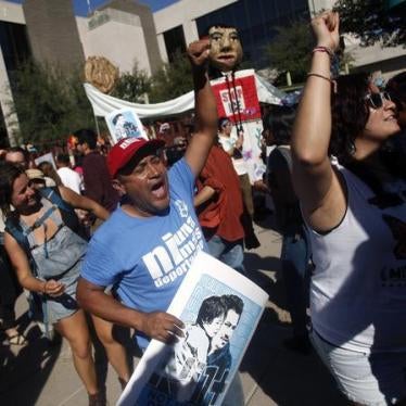 People protest against Immigration and Customs Enforcement at their headquarters in Phoenix, Arizona October 14, 2013. 