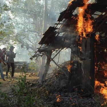  Militants burn down Shia houses on August 26, 2012, in the village of Nangkernang in Sampang regency, Madura Island. Hundreds of Sunni militants associated with the Ulema Consensus Forum torched around 50 Shia homes that day.