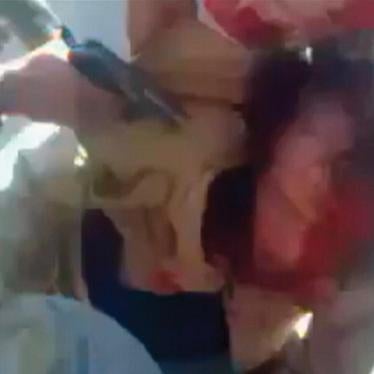 A still image taken from amateur video posted on a social media website and obtained by Reuters on October 21, 2011, shows former Libyan leader Muammar Gaddafi, held on the ground by opposition fighters in Sirte, with a gun pointed at his head.