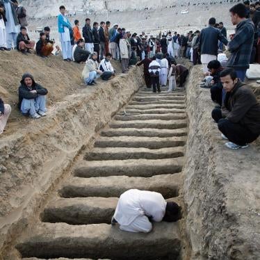 A man prepares graves for the victims of the February 17, 2013 vegetable market bomb attack in a Shia Hazara area of Quetta city in Pakistan.