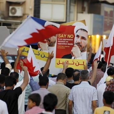 Protesters hold photos of Sheikh Ali Salman, Bahrain's main opposition leader and Secretary-General of Al-Wefaq Islamic Society, as they march asking for his release in the village of Jidhafs, west of Manama, in Bahrain on June 16, 2015. 