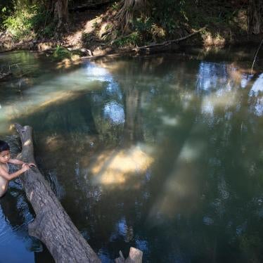 A 7-year-old boy swims in Klity Creek in Kanchanaburi, Thailand. The Pollution Control Department’s environmental tests for 2013 (the last year with all data published) regularly found unacceptably high levels of lead in soil along the creek bank.