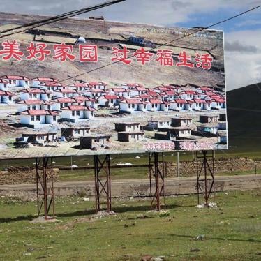 A propaganda billboard featuring a "New Socialist Village" in Sershul (Shiqu) County, Sichuan Province.  The billboard reads: "Build Beautiful Homeland, Live a Happy Life"