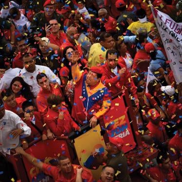 President Hugo Chávez waves to supporters on the day he registered for re-election in Caracas, Venezuela, on June 11, 2012.