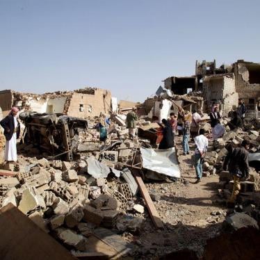 Residents sifting through the rubble of homes destroyed in an airstrike three days prior in Yareem town. The strike killed at least 16 civilians.