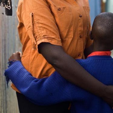 Kamene F. stands outside her house in a slum in Nairobi with her 7-year-old son born from rape.