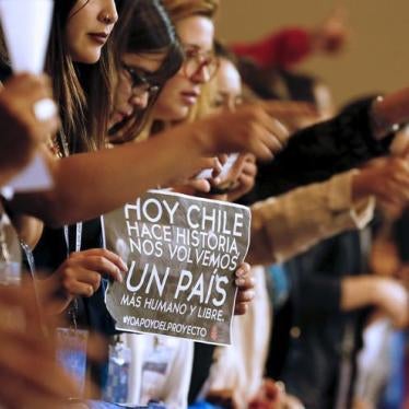 Demonstrators raie their thumbs in approval during a rally inside congress in favor of a draft law by the government, which seeks to ease the country's strict abortion ban, in Valparaiso, Chile March 17, 2016. The banner reads: "Chile makes history today,