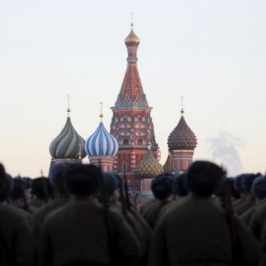Russian servicemen, dressed in historical uniforms, line up as they take part in a military parade rehearsal in front of St. Basil's Cathedral in Red Square in central Moscow, Russia, November 6, 2015.