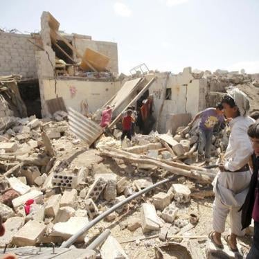 People inspect damage at a house after it was destroyed by a Saudi-led air strike in Yemen's capital Sanaa, February 25, 2016. 