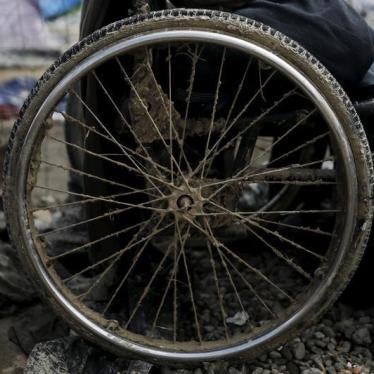 Mud covers the deflated wheel of an Iraqi refugee’s wheelchair outside his tent at a makeshift camp for refugees and migrants at the Greek-Macedonian border near the village of Idomeni, Greece, March 17, 2016.
