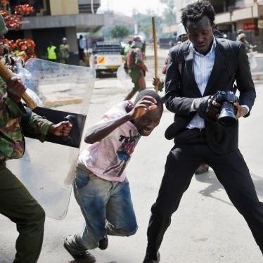 A Kenyan policeman beats a protester during clashes in Nairobi, Kenya May 16, 2016.