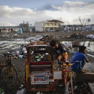 Survivors of Typhoon Haiyan pass the time at a school where hundreds have found shelter at, in Tacloban, Philippines, November 21, 2013.